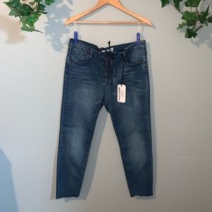 Mid rise skinny crop lace up jeans